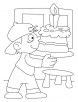 A boy holding a birthday cake coloring pages